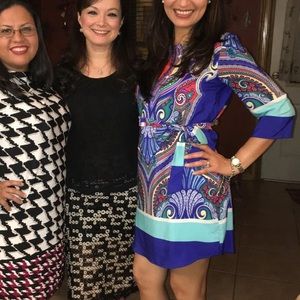 Renee C paisley print with beautiful colors. Dress with belt included